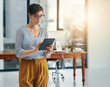 © peopleimages.com - Office, businesswoman and research with tablet for digital agency, scrolling and website information. Workplace, manager and planning with technology for online page, content creation and blog post