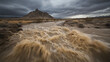 © Worakit - flash flood rapidly fills dry desert basin, showcasing power of nature. turbulent waters contrast with rugged mountain backdrop under dramatic sky