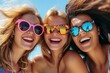 © Instacraft.Studio - Three young women are close together with big smiles. They are wearing colorful sunglasses.