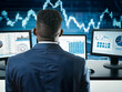 © TravelWorld - Man analysing financial data in monitors