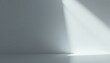 © NipaArts - Minimalist grey studio background with a beam of light.