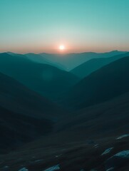 Poster - Silhouetted mountains at dusk, with a glowing sun.