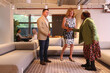 © Caia Image - Coworkers talking in modern office