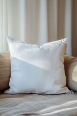 Poster - A white pillow sitting on top of a bed