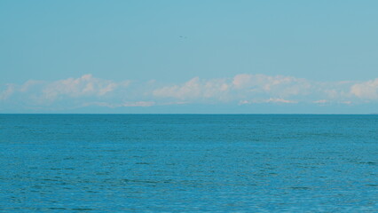 Beautiful Views Of The Sea And The Snow-Capped Mountains. Snow Capped Mountain And Sky.