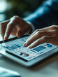 © john - A person's hands interact with a tablet displaying financial graphs, indicating a professional setting where business analytics and data review are being conducted.
