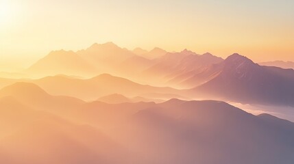 Mountain landscape at sunrise, misty clouds covering peaks, beautiful natural scenery, peaceful moment.