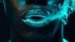 © NK - Close-up of lips with smoke glowing in neon light