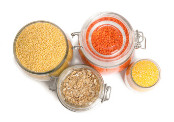 Poster - Different cereals and lentils in jars isolated on white, top view