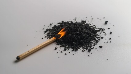 Burning charcoal with a lit match, illustrating the energy and intensity of fire for cooking or outdoor activities