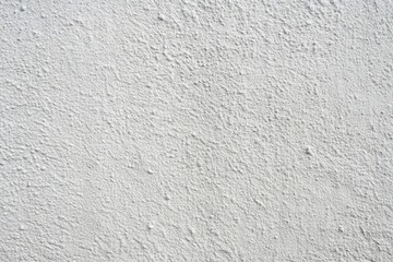 Grey cement texture on a white concrete wall background, high angle view