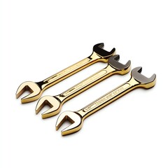 Three gold wrenches on a white isolated background