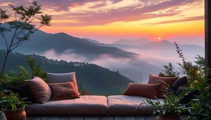 Poster - Tranquil sunset over mountains with a cozy seating area adorned with cushions and plants, overlooking misty hills and a colorful sky