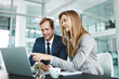 © ThurstanJam/peopleimages.com - Man, woman and laptop on office for research, meeting and advice for company growth. People, computer and discussion in workplace for teamwork, brainstorming or budget planning for financial year end
