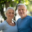 © ANC Media - An older couple smiles while exercising outdoors, focusing on their healthy lifestyle