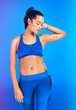 © Frank Coop/peopleimages.com - Thinking, fitness and woman on blue background for exercise, training and workout in studio. Personal trainer, gym mockup and isolated person for healthy body, wellness and performance for mobility