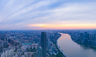 Aerial view of modern city skyline and buildings at sunrise in Shanghai