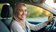 © Ali Hamza Tullah - Joyful Islamic lady in hijab driving auto and smiling at camera through window, enjoying road drive with hired vehicle, holding steering wheel, car drive concept, Driving Concept, Travel Concept