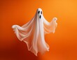 © namdarcreative - Floating white Ghost on orange background, Halloween concept