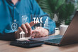 © NongAsimo - Annual tax payment, Tax calculation, Payment Digital Tax Calculation and Management Concept, Businessman calculation tax, Government taxes and financial management, Refund, Individual income