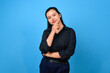 © Andri - Confused asian business women while looks good idea. Young business women in doubt, Not sure, looking for idea