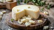 © Fay - Round of aged cheese on wooden cutting board with slices, perfect for cheese platter, food photography, or culinary background.
