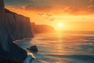 Canvas Print - A serene sunset over cliffs and ocean, with birds flying in the sky.