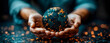 © TopMicrobialStock - Hands holding a sphere of the world.