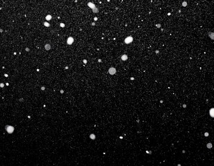 Wall Mural - snow on a black background for use as an overlay layer