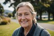 © ThomasLENNE - Close portrait of a smiling senior New Zealander woman looking at the camera, New Zealander outdoors blurred background