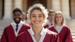 ©  Jovaduplex - A radiant graduate in a red robe beams with joy, celebrating with fellow students outdoors on graduation day, signifying academic achievement and new opportunities ahead.