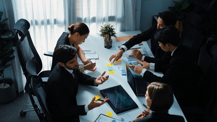 Top view of diverse business people brainstorm marketing idea while marketing team analyst stock market investment. Group of skilled project manager solving problems and sharing plan. Directorate.