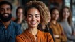 © Five Million Stock - Diverse and inclusive group of office colleagues smiling at a team building workshop event, workplace race inclusion and diversity concept