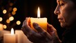 © AIrina - Woman Holding Candle During Memorial Service