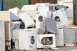 © MAXSHOT_PL - Pile of discarded household appliances for e-waste disposal