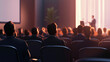 © Michael - Corporate professionals seated in conference room, attentively listening to a speaker's presentation