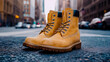 © Nikname - Pair of classic tan work boots positioned on a city street.