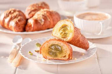 Wall Mural - Homemade and hot pistachio croissants as french snack.