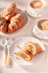 Wall Mural - Traditionally and sweet pistachio croissants with nut filling.