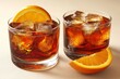 © Leo - Pair of whiskey glasses garnished with fresh orange slices placed on a white surface with a soft glow capturing the warmth and elegance of a classic evening drink