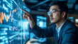 © 藤田信夫 - 大型モニターを指さす眼鏡の若いエンジニア
