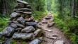 © pinporn manosri - Rough natural stones piled along a hiking trail, offering a rugged and adventurous path