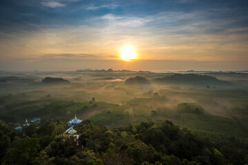 Wall Mural - Landscape of beautiful morning fog sunrise at Khao Na Nai Luang Dharma Park in Surat Thani province, Thailand