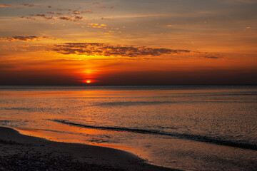 Sticker - Sandy beach with pebbles of Baltic Sea on Curonian Spit at sunset. Kaliningrad region. Russia