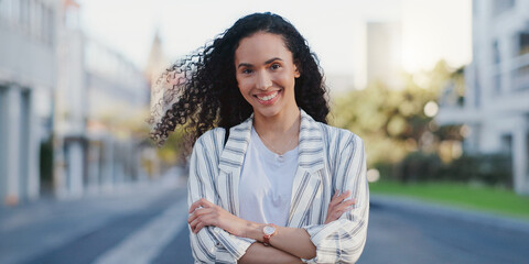 Sticker - Happy, portrait and businesswoman with crossed arms in city for travel, commute and walk to office. Smile, confident and female lawyer with positive attitude for outdoor journey in town in Canada.