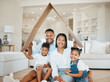 © KayExam/peopleimages.com - Happy family, portrait and cardboard with roof for shelter, real estate or property investment at home. Mother, father and children with smile for house cover, insurance or love in safety or security