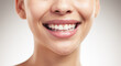 © Flashizzle/peopleimages.com - Woman, mouth and smile in studio for dental care, hygiene and results of teeth whitening. Person, happy and wellness on gray background for plaque treatment, fresh breath or healthcare with aesthetic