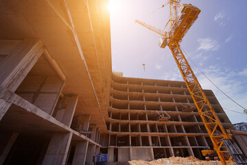 Building under construction with a crane in the foreground