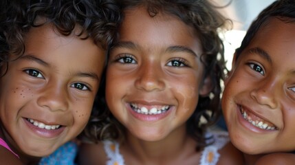 Wall Mural - A close-up of three kids from various ethnic backgrounds, smiling brightly