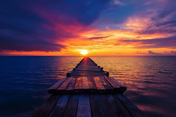 Wall Mural - Witness a breathtaking sunset as vibrant colors fill the sky and reflect on the serene waters, viewed from a secluded pier